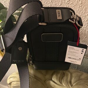 *NEW* TUMI Black crossbody traveling bag.